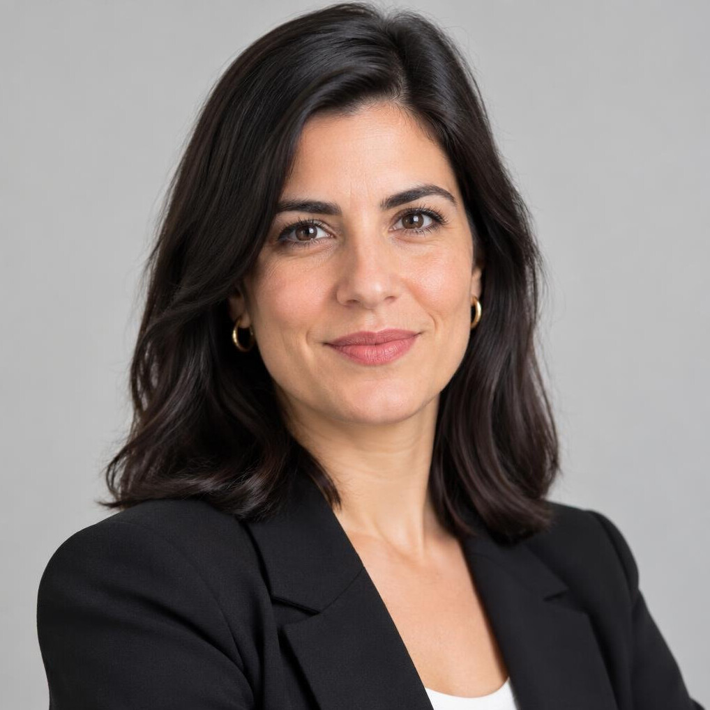 Studio portrait of a Portuguese woman journalist with dark hair