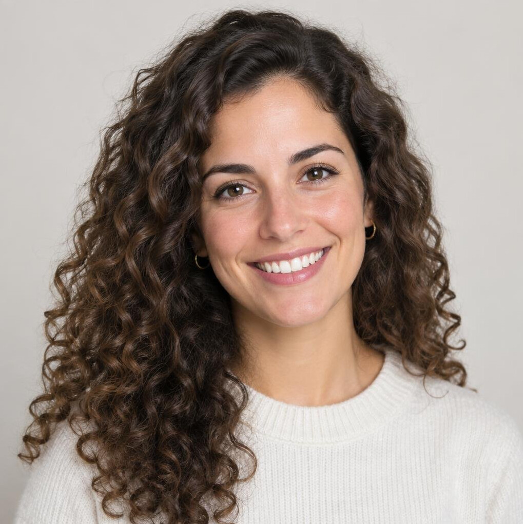 Studio portrait of a young Portuguese woman with curly hair